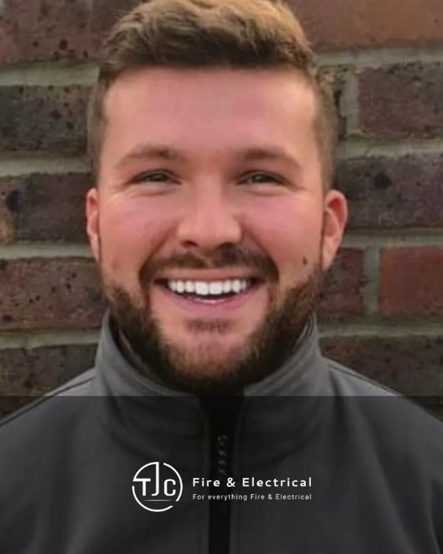 Taran Cole smiling in TJC branded workwear