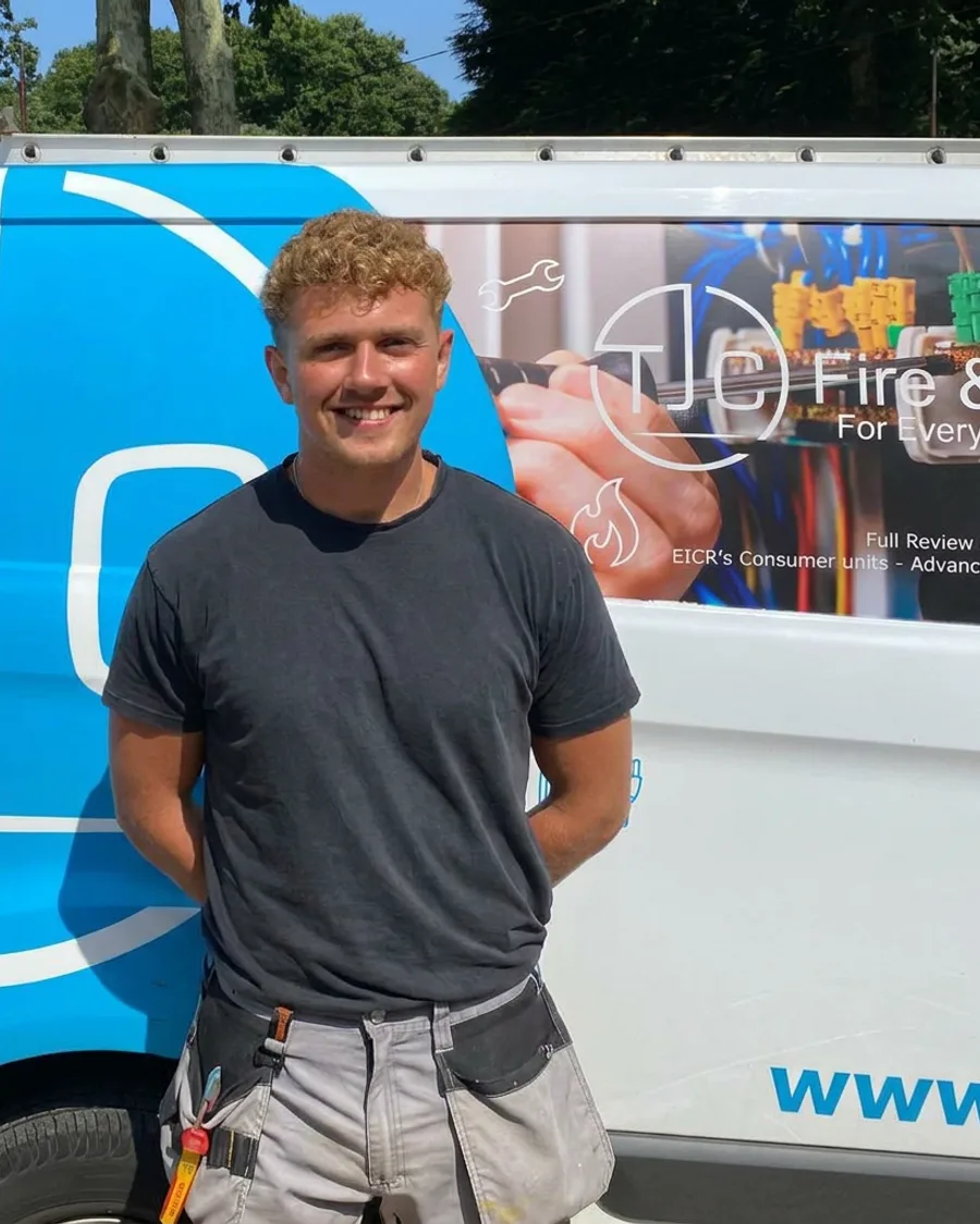 Harry beside a TJC vehicle