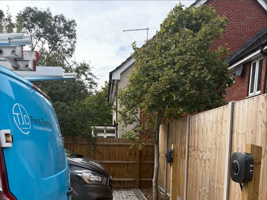 Rolec EV chargers on posts beside the TJC van
