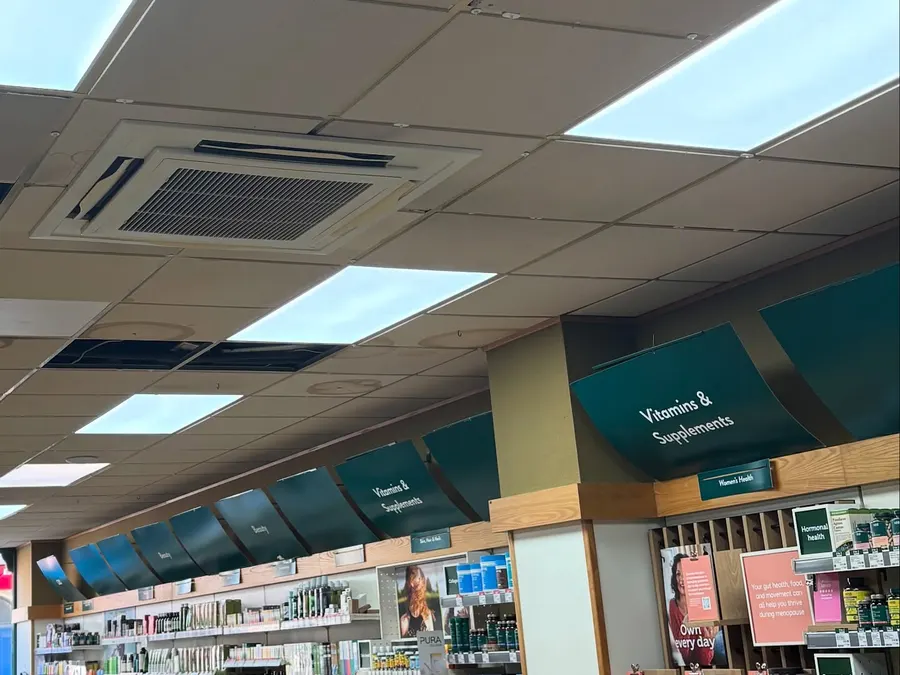 Smoke detector and LED panels in a retail suspended ceiling