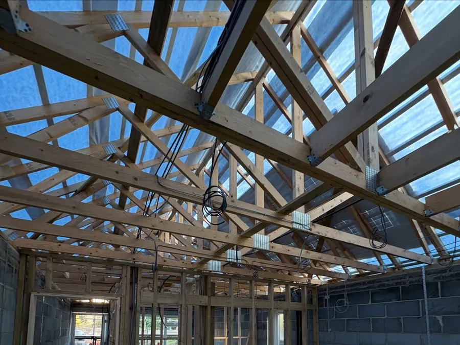 First-fix wiring through stud walls and trusses of a bungalow