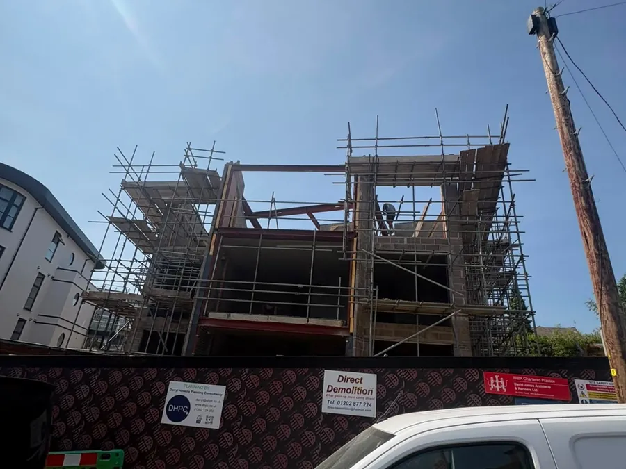 Apartment development under construction with scaffolding