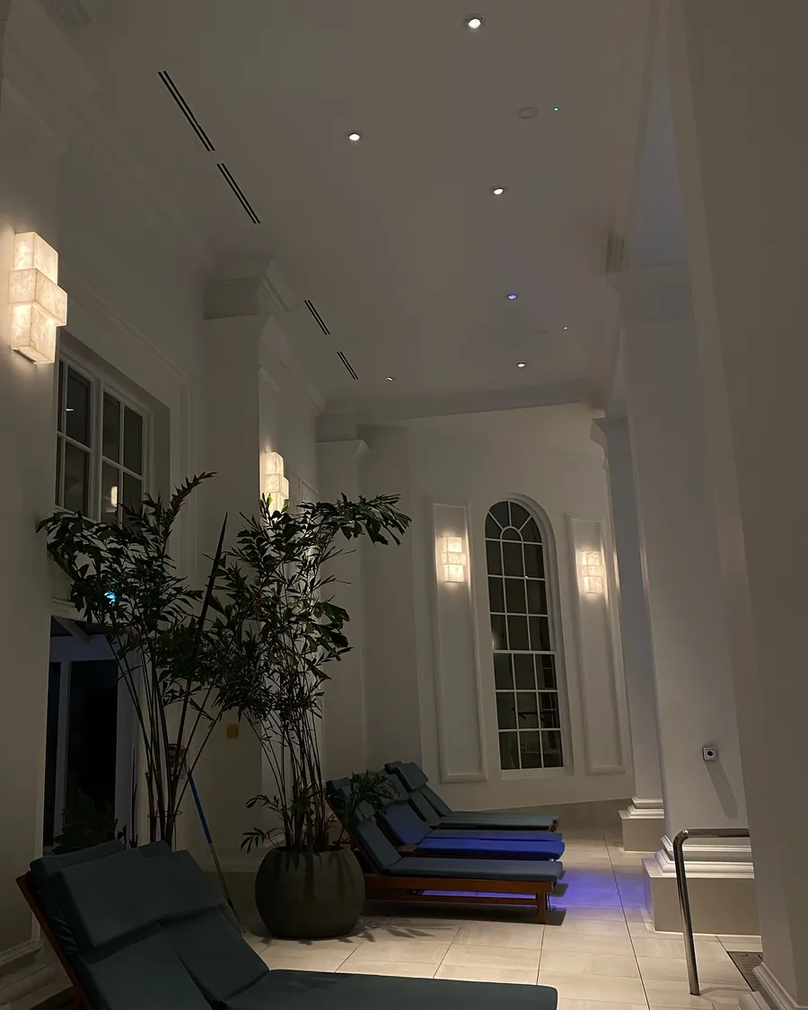 Spa relaxation room with wall lights and loungers